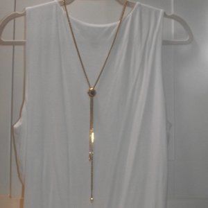 Green and goldtone lariat style necklace